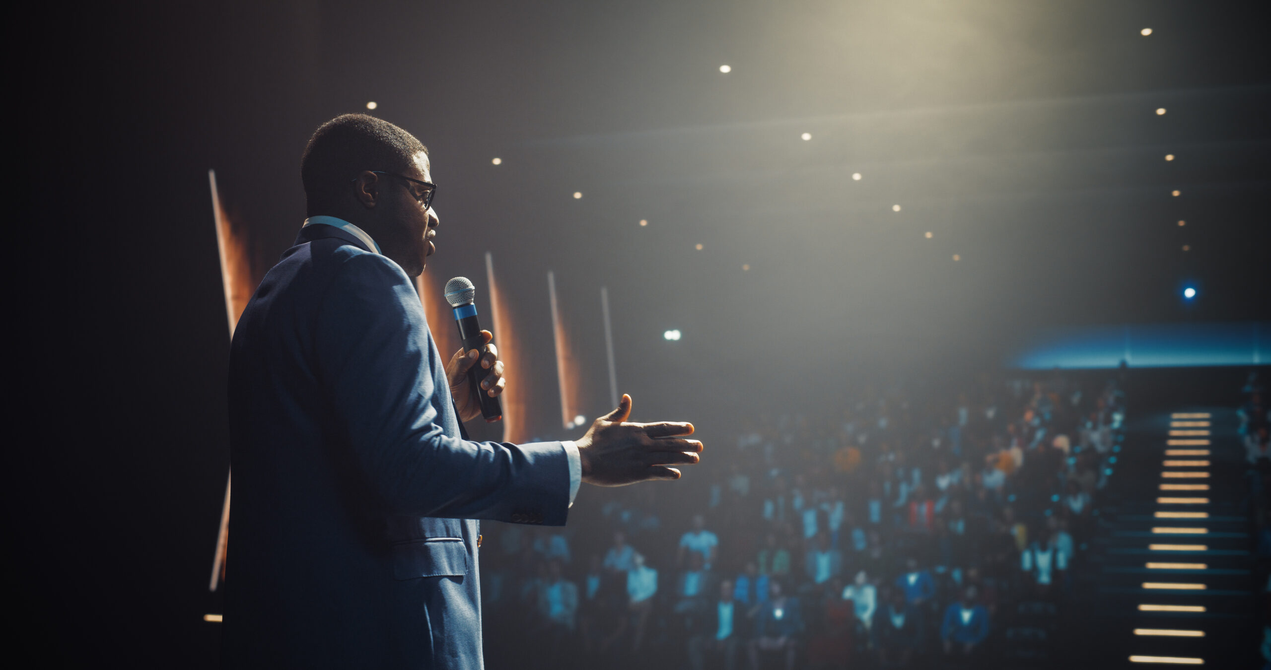 Business meeting with executive presenting to audience